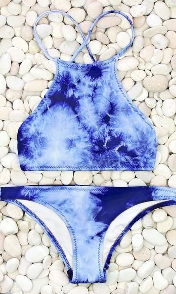 Add a splash of blue to your beach holiday with this blue cloud print bikini. It...