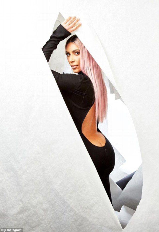 Cheeky! Kim flashed ample amounts of her peachy behind in a daring black turtlen...