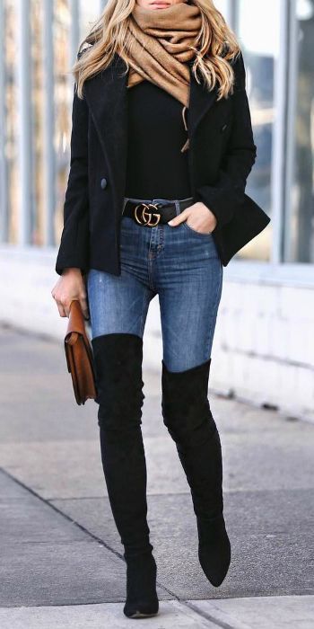 Helena Glazer + pair of striking thigh high boots + skinny denim jeans + stateme...