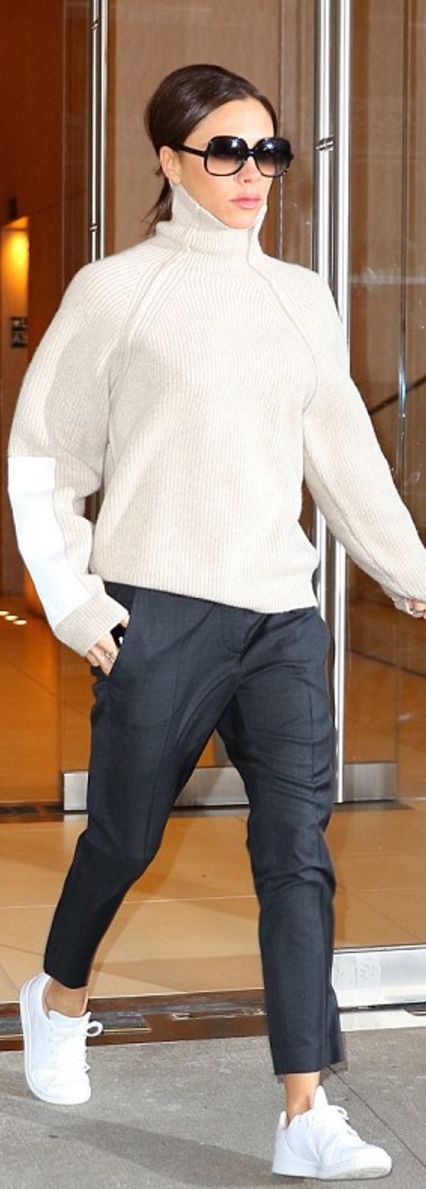 Who made  Victoria Beckham's white sneakers, ribbed turtleneck sweater, blue...