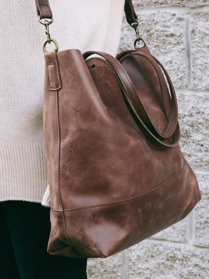 Abera Crossbody Leather Tote can be worn over the shoulder, or across your body,...