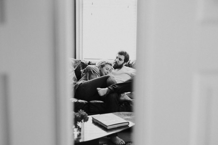 Cozy in-home engagement photos. Lifestyle photography. Photos on couch. St. Loui...