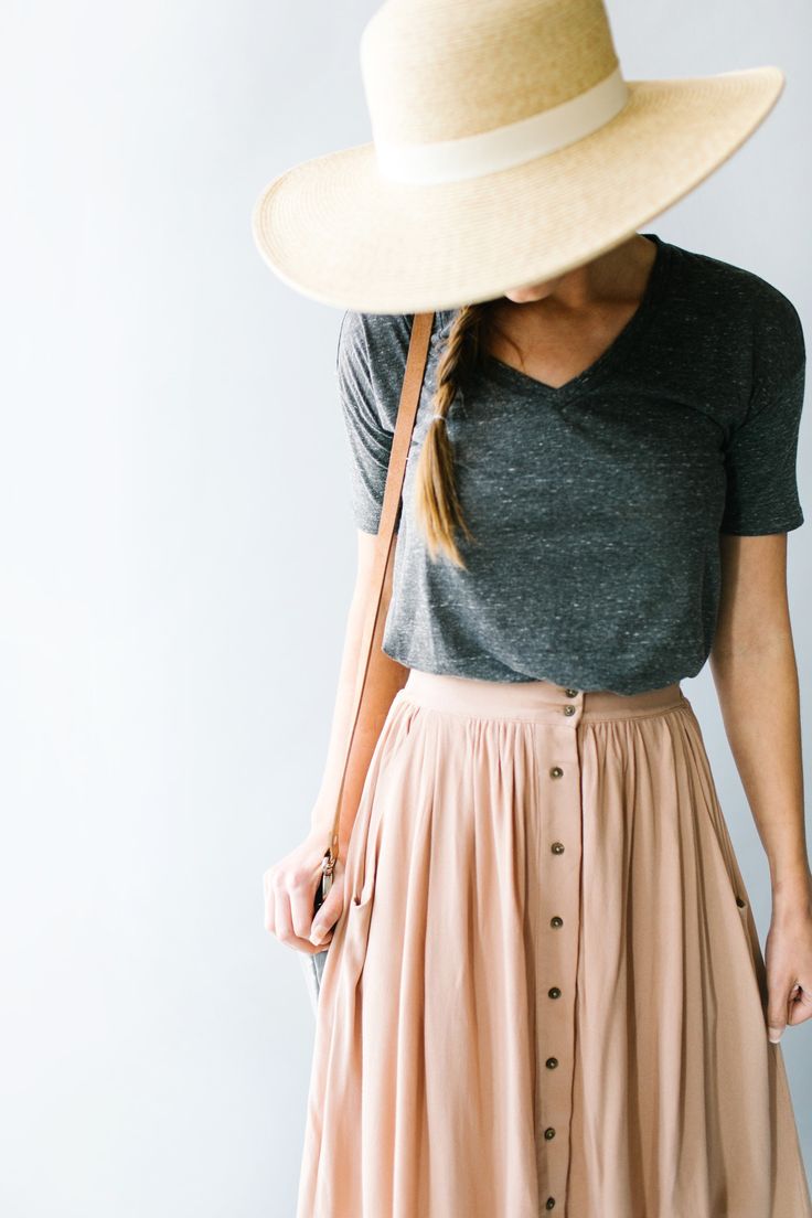 Feminine meets practical in this sweet button-down skirt with front pockets and ...