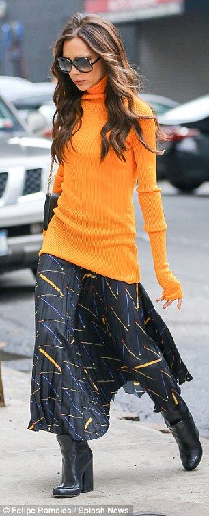 Orange you stylish! The 41-year-old swapped her usually all-black look for a bri...