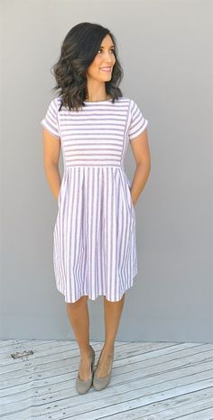 Our chambray stripe pleated dresses are oh so stylish. They have pockets, are kn...
