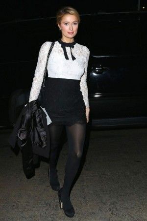 Paris Hilton wearing Chanel Black Lambskin Jumbo Maxi Flap Bag and Nasty Gal Tie...