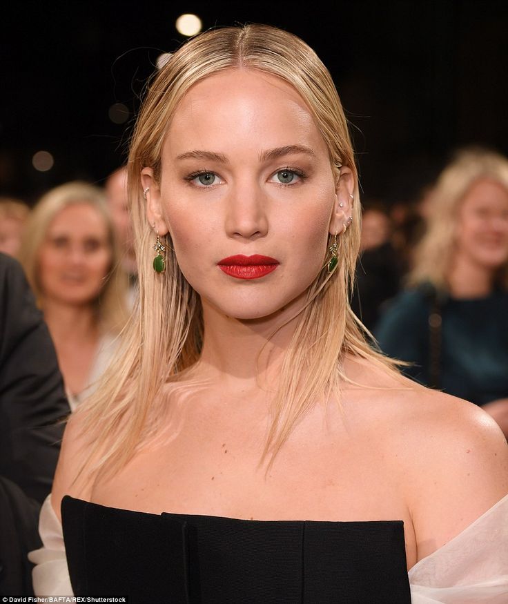 Striking: She added a slick of red lipstick to offset the black garment... #jenn...