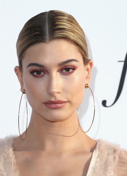 Hailey Baldwin Chignon - Hailey Baldwin styled her hair into a sleek center-part...