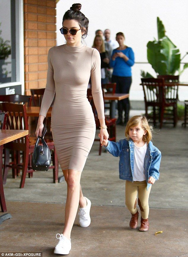 Leading the way: Kendall Jenner held her niece Penelope's hand on a breakfas...
