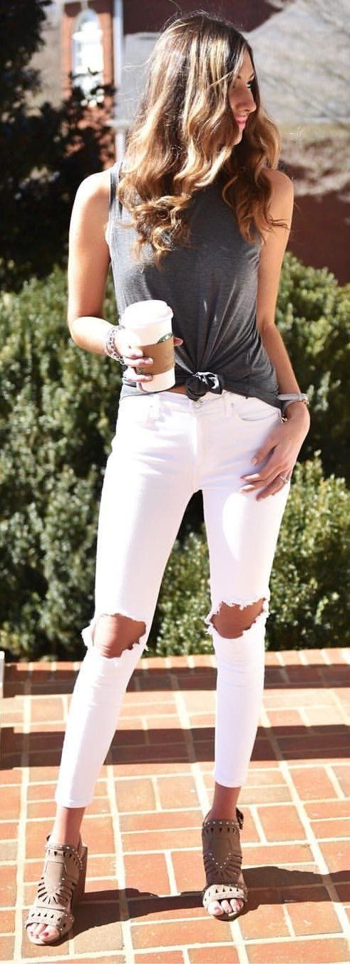 #spring #outfits woman in gray sleeveless top and white distress jeans. Pic by @...