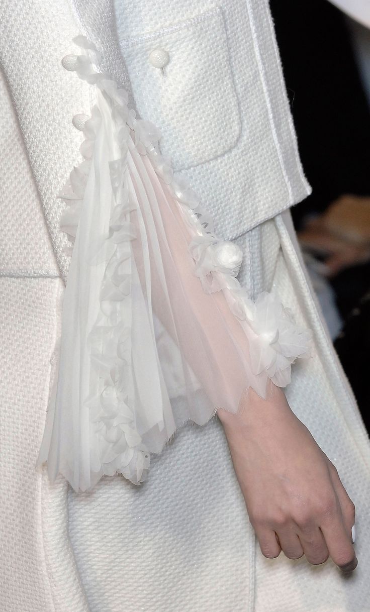 Elegant tailoring with delicate sheer fabric pleated sleeve insert; white on whi...