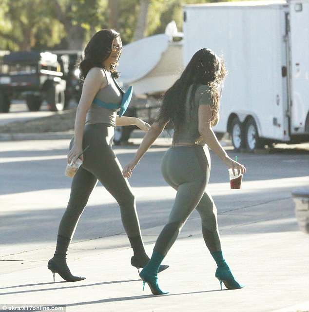 Happy gals: The two seemed to be full of beans as they looked to be working on a...