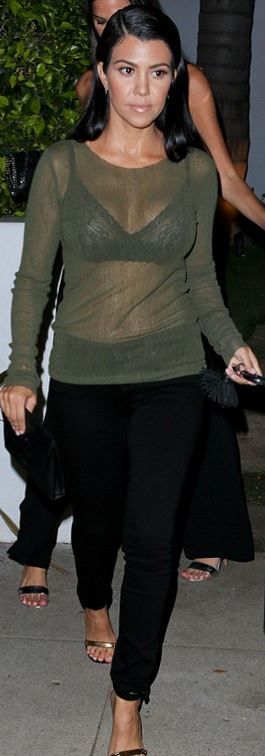 Kourtney Kardashian: Bracelet – Cartier  Purse – Celine  Sweater – Asilio