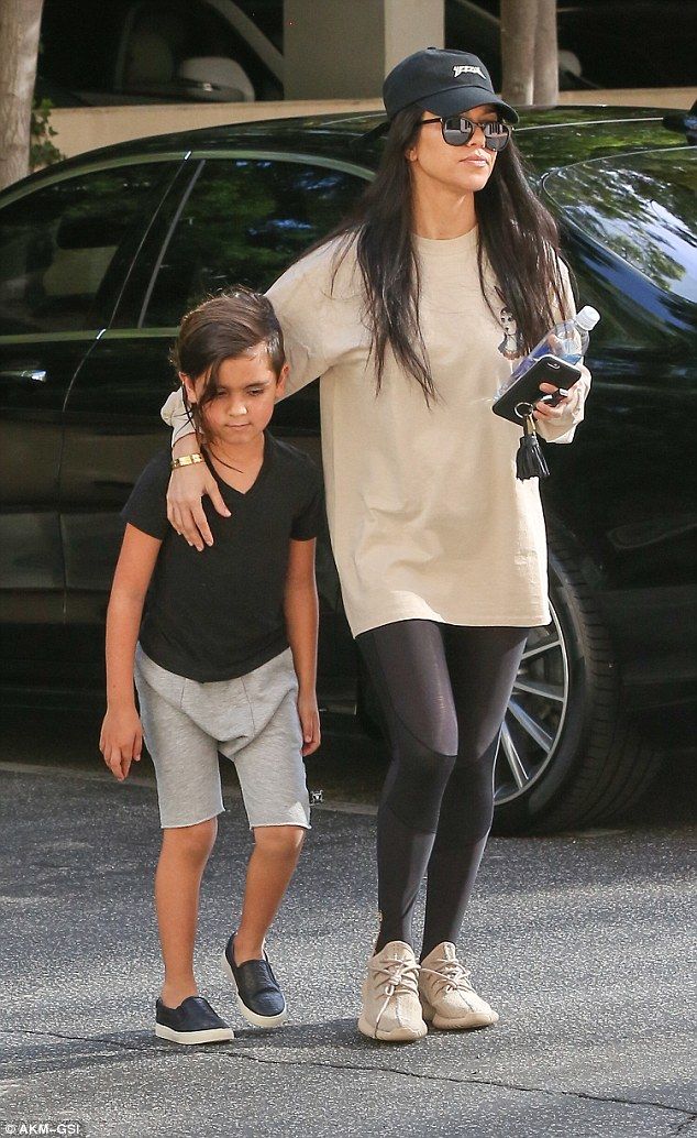 Mummy's boy: Kourtney Kardashian's eldest child Mason looked to be grow...
