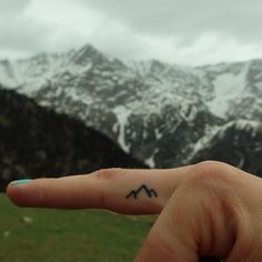 This sweet tiny tattoo of mountains is a good reminder to all of us to get outsi...